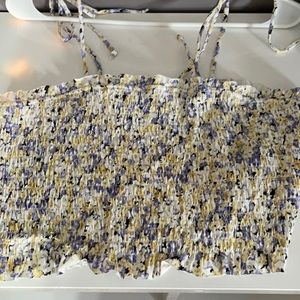 Floral top with blue and yellow in it